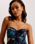 RAINNAH-Swimwear-Find a beautiful beach get-up in RAINNAH. It's up front elegance with a botanical print and button details, and a little racier in the back with a cut-out detail and high rise leg. Built-in wired cups and adjustable straps keep you supported for a comfortable fit. Swimsuit Built-in wired cups Botanical print Button front detail Wide adjustable straps Back clasp fastening with cut out High rise leg Stephanie is 5'8.5" / 1.74m and wears a Ted size 1- Ted Baker Romania